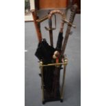 A STICK STAND CONTAINING TWO SWORDS, together with four parasols, one gold mounted and another