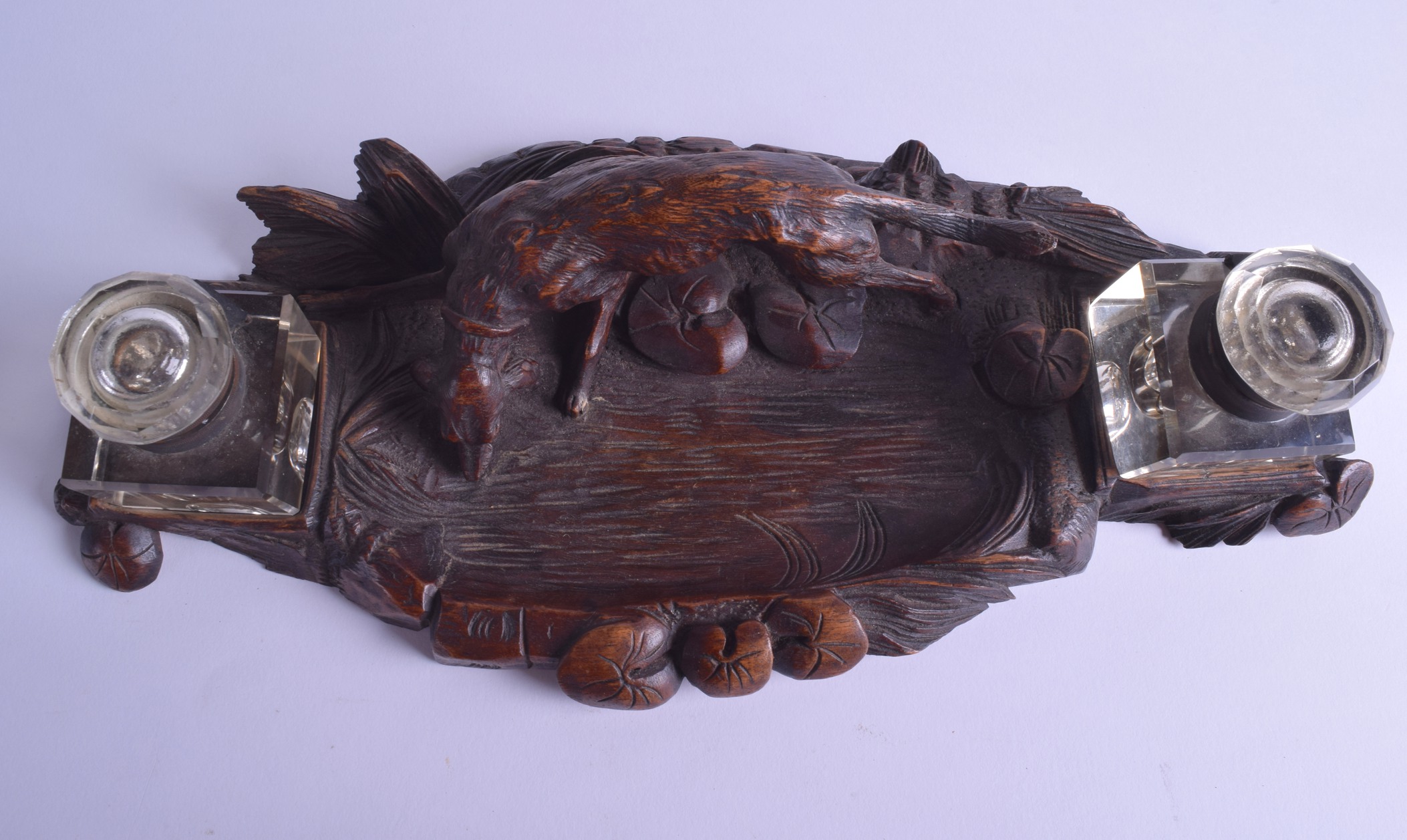 A LATE 19TH CENTURY BAVARIAN BLACK FOREST CARVED INKWELL modelled with a hound drinking water from a - Image 3 of 4