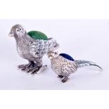 TWO SILVER PIN CUSHIONS, formed as standing birds. Largest 5.4 cm wide.