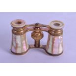 A PAIR OF 19TH CENTURY FRENCH GILT BRASS AND MOTHER OF PEARL OPERA GLASSES. 9 cm wide.