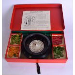 A VINTAGE CASED ROULETTE SET.