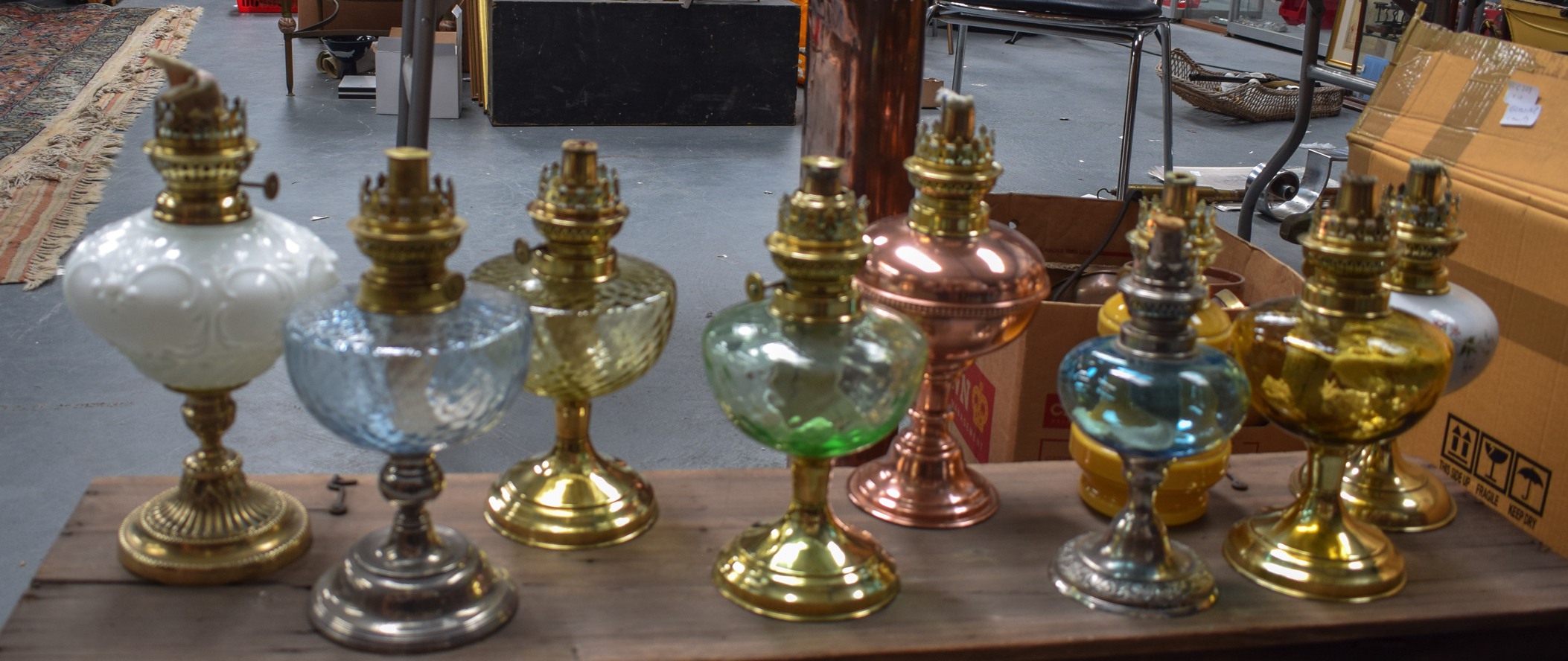 A GOOD GROUP OF TEN ASSORTED OIL LAMPS, of varying style and design. (10)