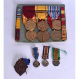 A GROUP OF NINE MILITARY MEDALS together with a copper badge. (10)