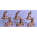 A SET OF THREE FRENCH ART DECO BRONZE FIGURES OF ANTELOPES each modelled in a leaping stance. 12