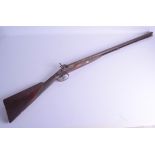 A 19TH CENTURY DUAL BARREL FLINTLOCK RIFLE by D Leonard & Sons, with silvered mounts and floral