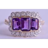 A 9CT GOLD DIAMOND AND TRIPLE AMETHYST RING. Size N/O.