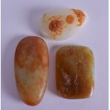 THREE CARVED JADE TABLETS 20th Century. Largest 6.5 cm x 4 cm. (3)