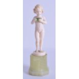 A FINE EARLY 20TH CENTURY CARVED IVORY FIGURE OF A FEMALE by Ferdinand Preiss, modelled holding a