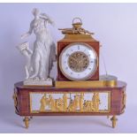 A FINE EARLY 19TH CENTURY FRENCH EMPIRE PARIAN WARE FOUNTAIN MANTEL CLOCK modelled as a classical