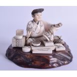 A 19TH CENTURY JAPANESE MEIJI PERIOD CARVED IVORY OKIMONO modelled as an ivory sculpture or artisan.