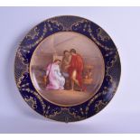 A LARGE 19TH CENTURY VIENNA PORCELAIN DISH painted with three classical figures within an