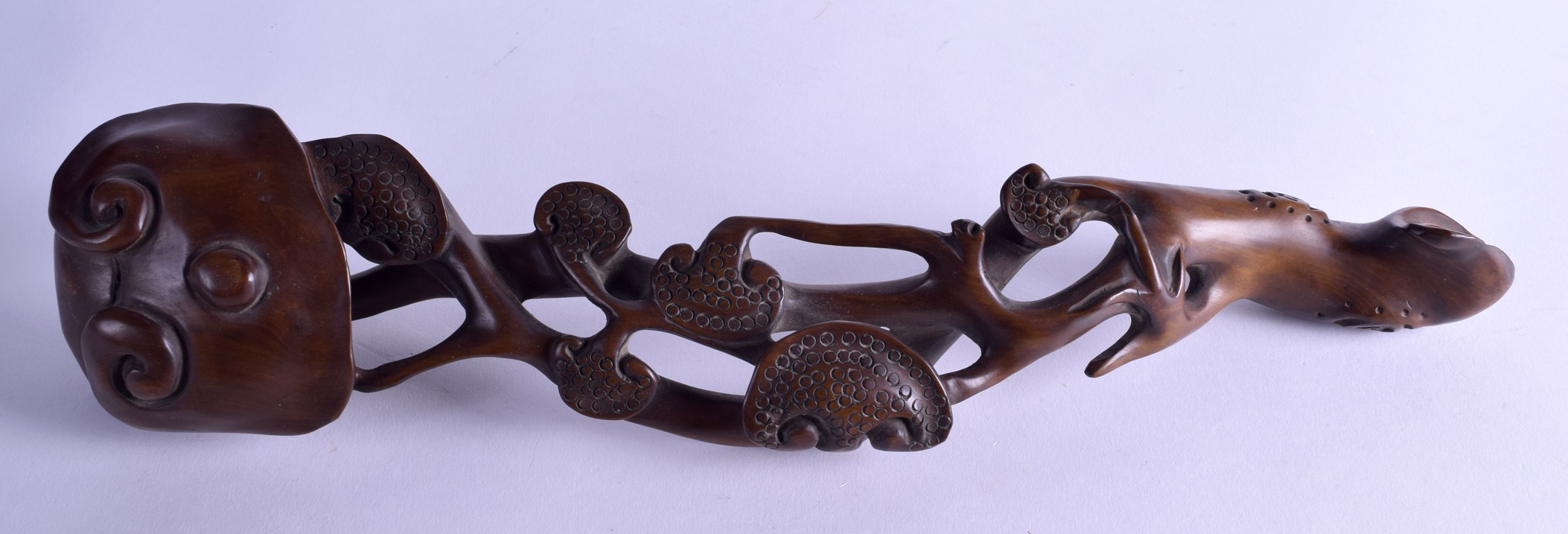 A LARGE CHINESE CARVED HARDWOOD RUI SCEPTRE of naturalistic form. 30 cm long.