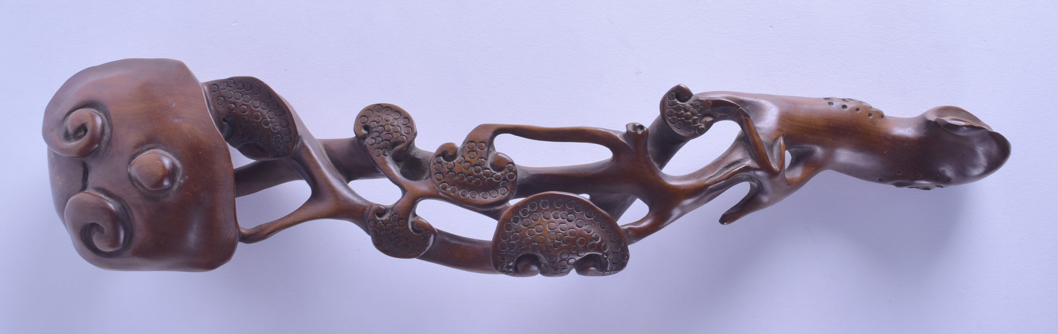 A LARGE CHINESE CARVED HARDWOOD RUI SCEPTRE of naturalistic form. 40 cm long.