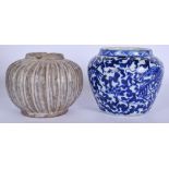 AN EARLY CHINESE POTTERY JAR WITH RIBBED BODY, together with a blue and white porcelain vase