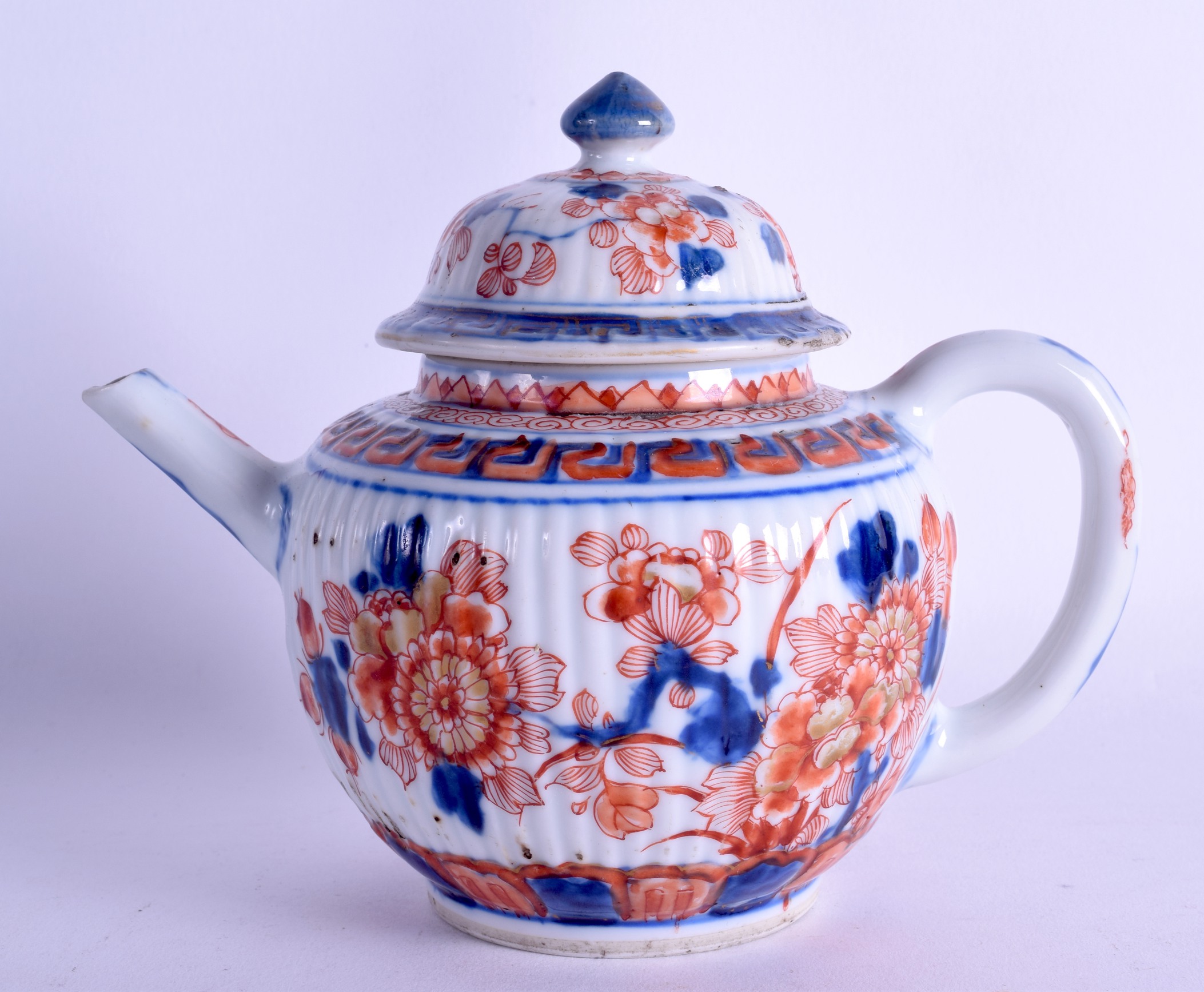 AN EARLY 18TH CENTURY CHINESE IMARI RIBBED TEAPOT AND COVER Qianlong, painted with foliage and