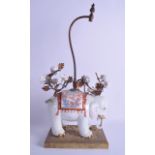 A GOOD 19TH CENTURY FRENCH SAMSONS OF PARIS PORCELAIN FIGURE OF AN ELEPHANT modelled in the