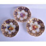 A GOOD GROUP OF THREE ROYAL WORCESTER CABINET PLATES painted with still lives of fruit, under a blue