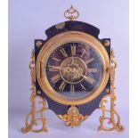 AN UNUSUAL LATE 19TH CENTURY FRENCH EBONISED BRASS STRUT MANTEL CLOCK with scrolling classical frame