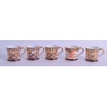 A SET OF FIVE ROYAL CROWN DERBY MINIATURE IMARI CUPS painted with flowers. 5 cm wide. (5)