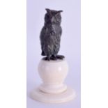 A 19TH CENTURY EUROPEAN COLD PAINTED BRONZE OWL upon a turned ivory base. 9.5 cm high.