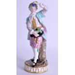 19th c. Meissen figure of a boy holding grapes in his hand and hat wearing striped pantaloons