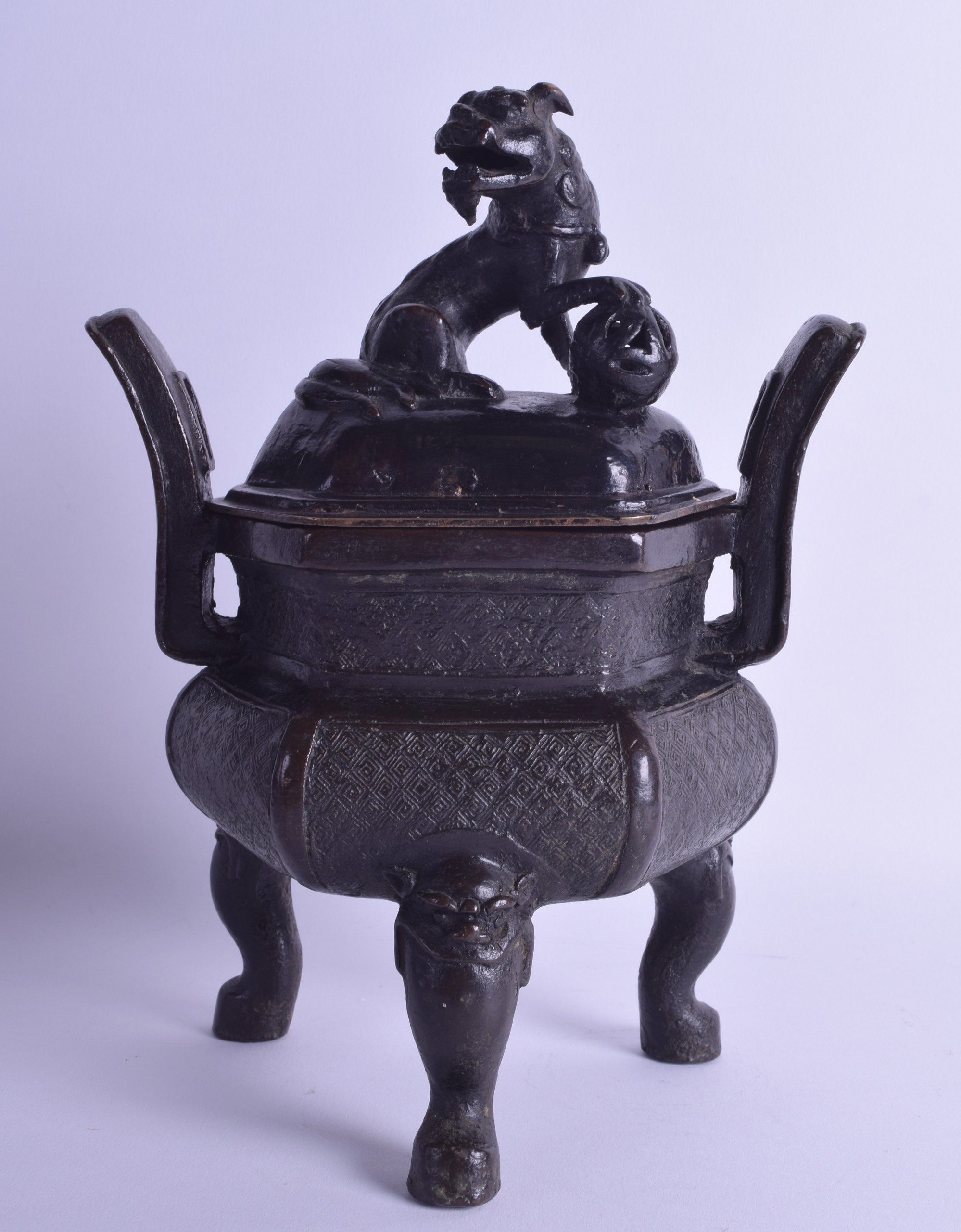 A 16TH/17TH CENTURY CHINESE TWIN HANDLED BRONZE CENSER AND COVER Ming, the finial formed as a