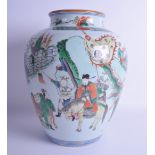 A 19TH CENTURY CHINESE FAMILLE VERTE PORCELAIN VASE Kangxi style, painted with figures, horses and