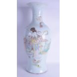 A LARGE EARLY 20TH CENTURY CHINESE FAMILLE ROSE BALUSTER VASE painted with a female and spotted