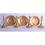 A SET OF FOUR 19TH CENTURY FRENCH PARIS PORCELAIN GILT CANDLESTICKS painted with armorials, together