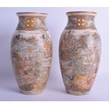 A PAIR OF 19TH CENTURY JAPANESE MEIJI PERIOD SATSUMA VASES painted with figures within elaborate