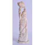 A 19TH CENTURY JAPANESE MEIJI PERIOD CARVED IVORY OKIMONO modelled as daikoku holding aloft a