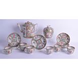 A 19TH CENTURY CHINESE CANTON FAMILLE ROSE PART TEASET including a teapot, cups, saucers & a