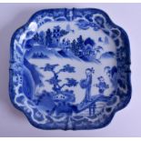 AN EARLY 19TH CENTURY JAPANESE EDO PERIOD BLUE AND WHITE DISH painted with two figures within a