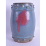 A CHINESE QING DYNASTY JUNYAO STONEWARE GLAZED POTTERY BARREL with purple splash decoration. 15 cm