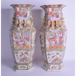 A FINE LARGE PAIR OF 19TH CENTURY CHINESE CANTON FAMILLE ROSE VASES of hexagonal form, painted