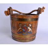 AN ANTIQUE PAINTED CRESTED OAK BARREL painted with lions and a unicorn. 35 cm x 29 cm.