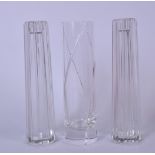 A PAIR OF TIFFANY & CO GLASS VASES, with reeded body together with another similar. 20 cm high. (3)