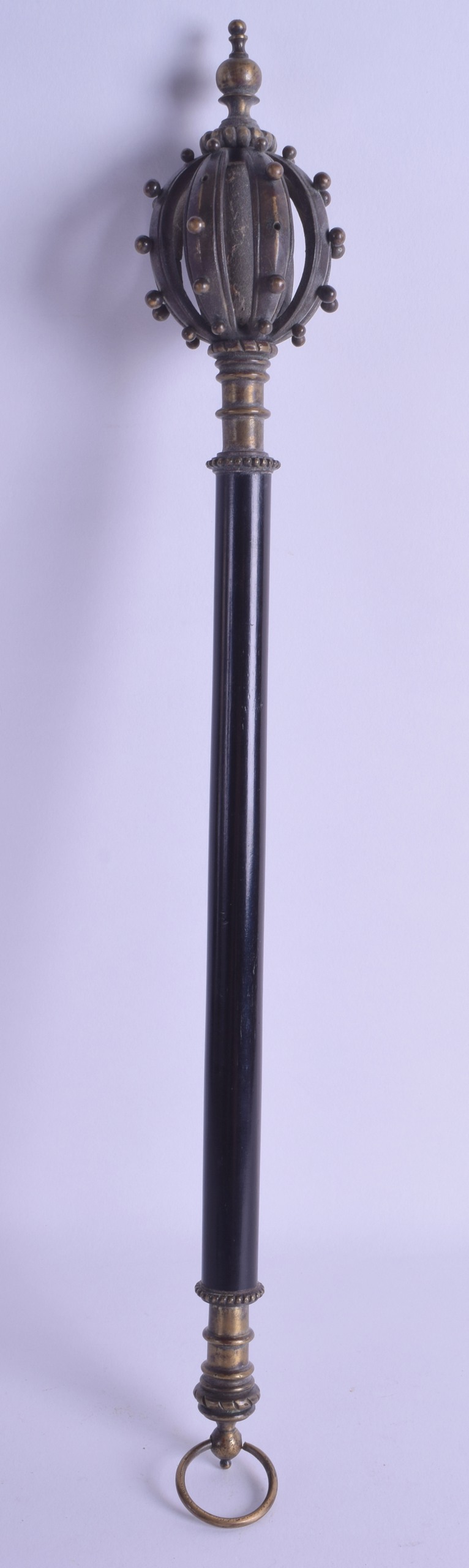 A 19TH CENTURY EUROPEAN BRONZE AND EBONY MACE with open work crown like finial. 46 cm long.