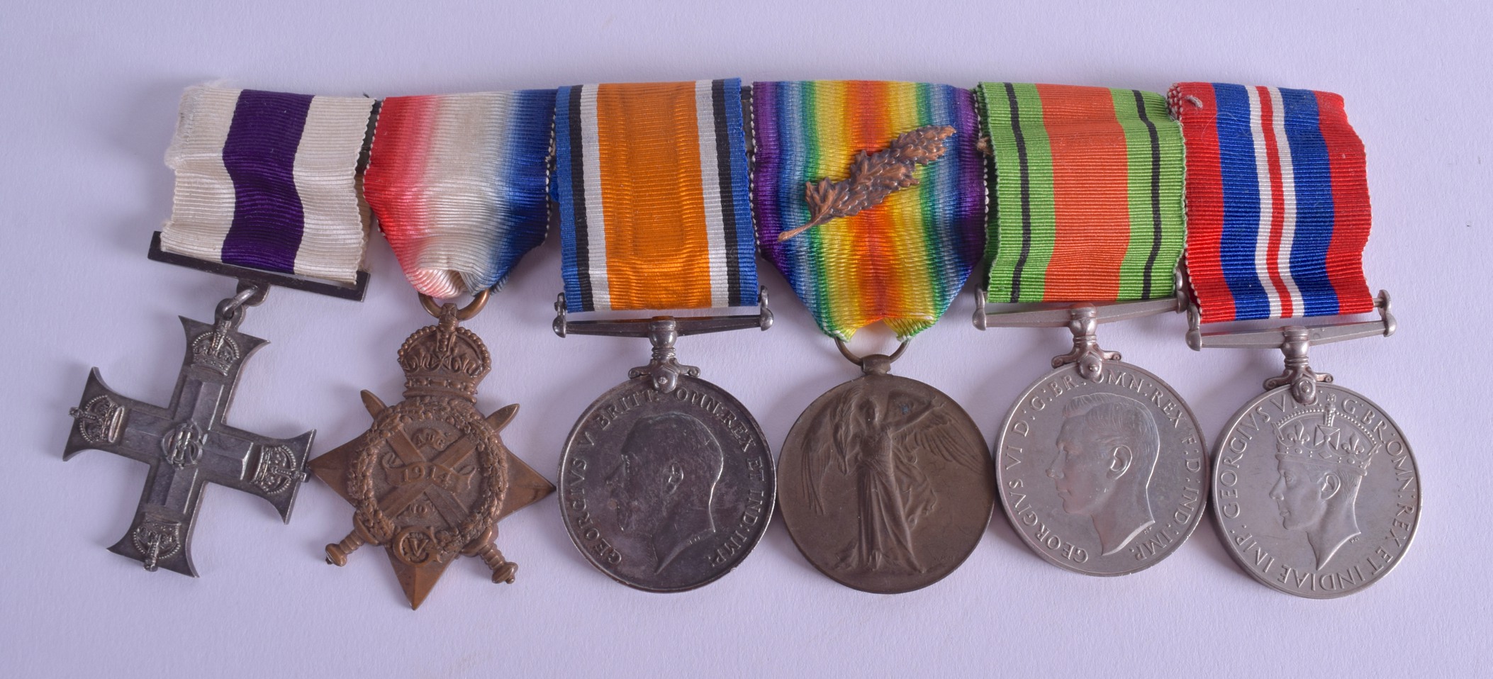 A MILITARY CROSS MEDAL SET presented to Major C W G Bryan. (6)