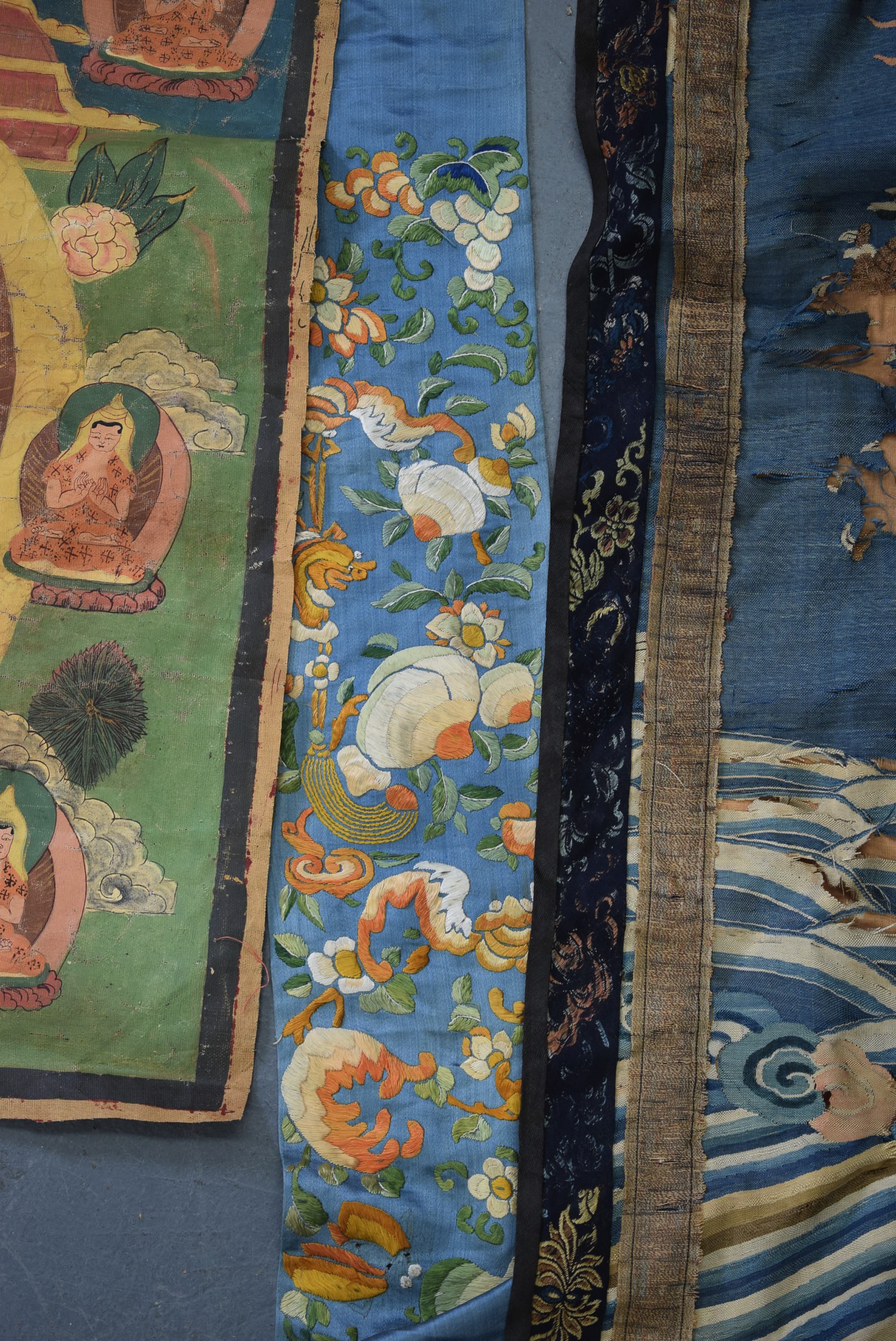 A 19TH CENTURY CHINESE BLUE GROUND EMBROIDERED SILK PANEL, together with a Thangka and two other - Image 3 of 6