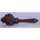 A CARVED BLACK FOREST WOODEN NUT CRACKER, in the form of a ram head. 19 cm wide.