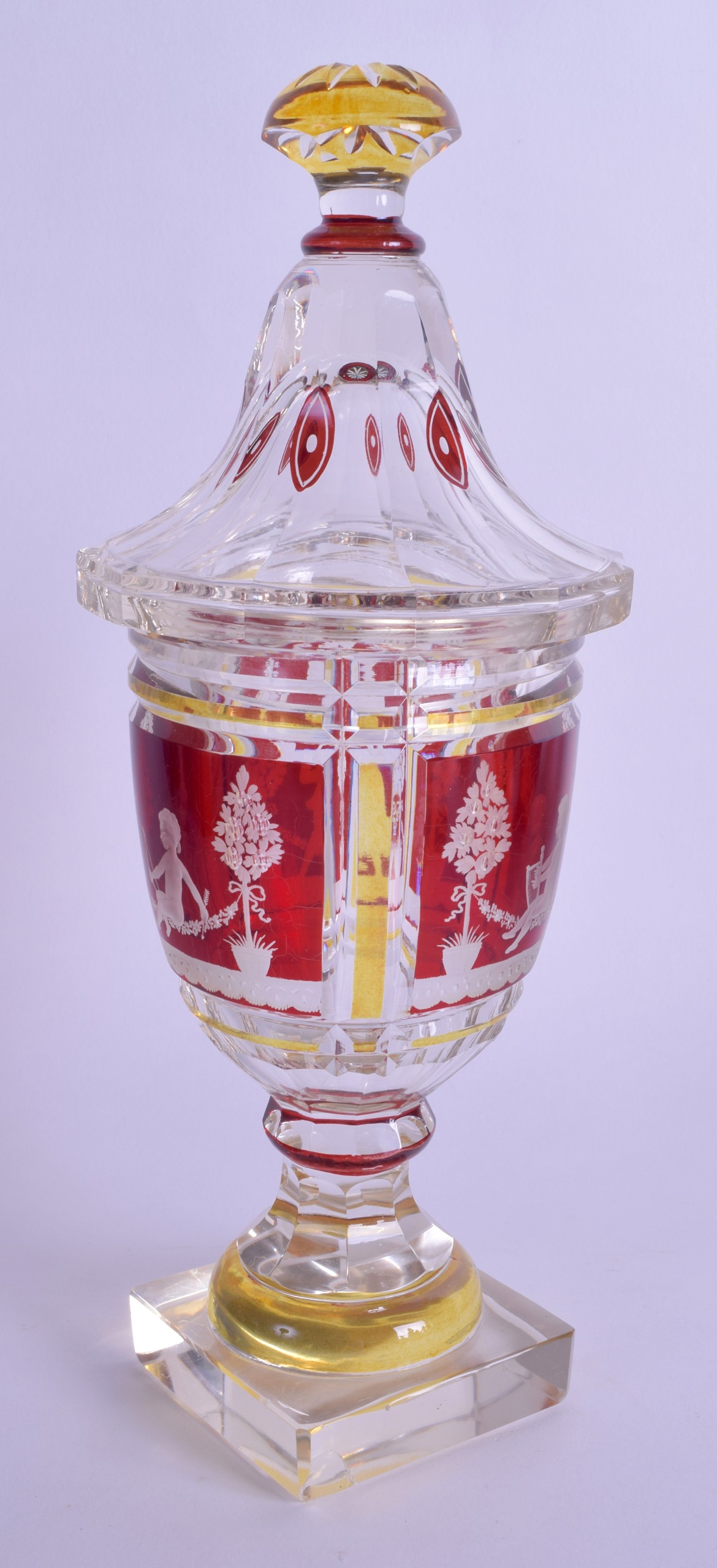 A 19TH CENTURY BOHEMIAN RUBY YELLOW AND CLEAR GLASS VASE AND COVER decorated with figures within - Image 2 of 2