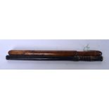 AN EARLY 20TH CENTURY WOODEN NIGHT STICK, together with a similar truncheon. Largest 56 cm .