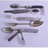 A SET OF FIVE VINTAGE BRASS AND STEEL COMBINATION KNIFE AND FORK SETS possibly Campaign. (5)