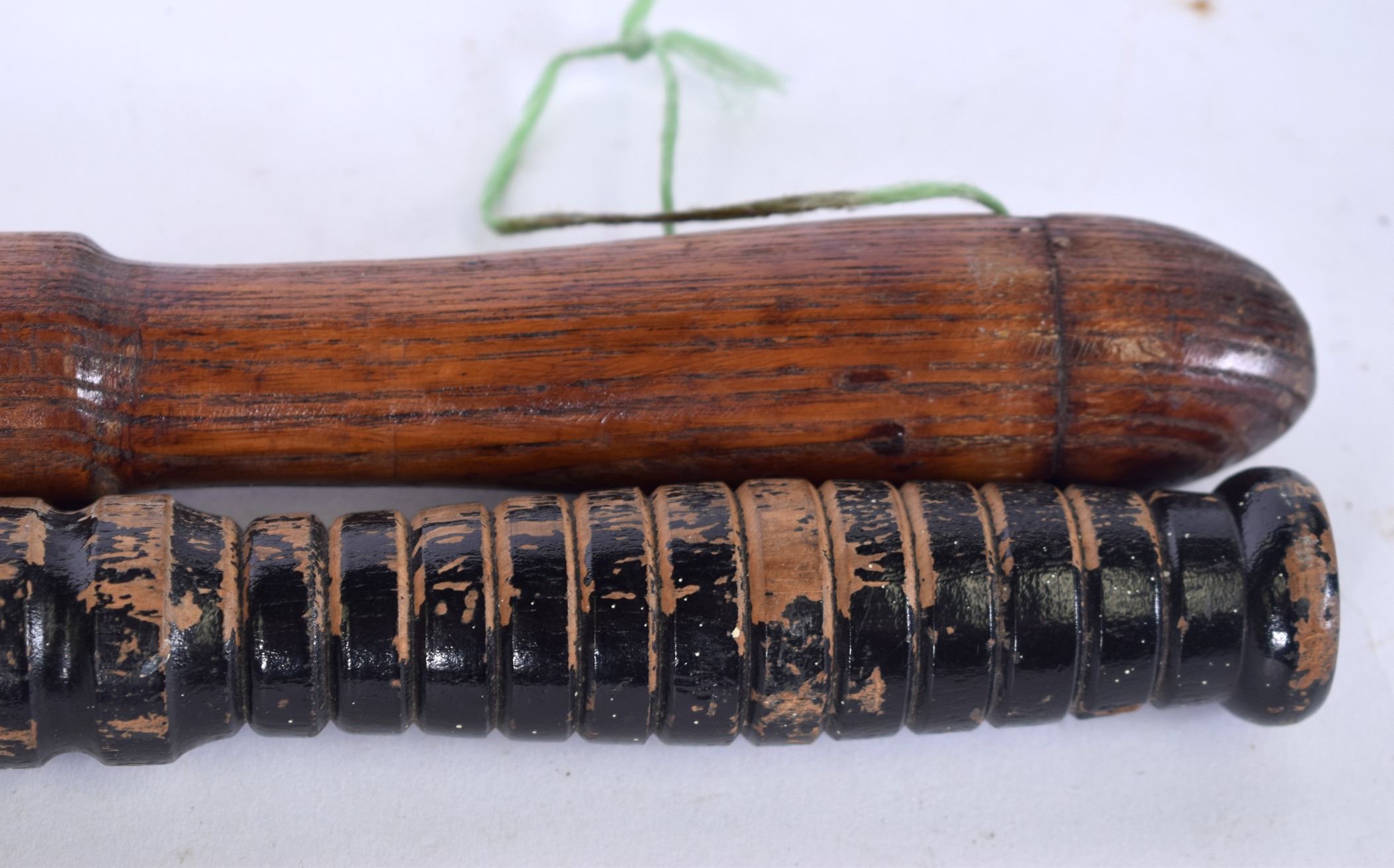 AN EARLY 20TH CENTURY WOODEN NIGHT STICK, together with a similar truncheon. Largest 56 cm . - Image 2 of 3