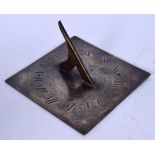 A 19TH CENTURY BRONZE SUN DIAL, incised decoration depicting Father Time. 15 cm wide.