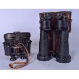 A LARGE PAIR OF BINOCULARS BY BARR & STROUD CONTAINED IN A LEATHER CASE, together with a small pair,