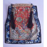 A LATE 19TH CENTURY CHINESE RED SILKWORK BAG decorated with blue floral sprays. 42 cm x 36 cm.
