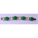 A STYLISH 1920S CRYSTAL GREEN GLASS DECO BRACELET engraved with foliage and stylised motifs. 19 cm