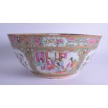 A LARGE 19TH CENTURY CHINESE CANTON FAMILLE ROSE PORCELAIN BOWL Qing, painted with figures within